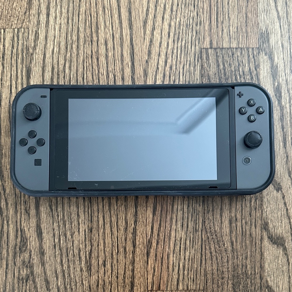 Nintendo Switch with protective cover and carrying case